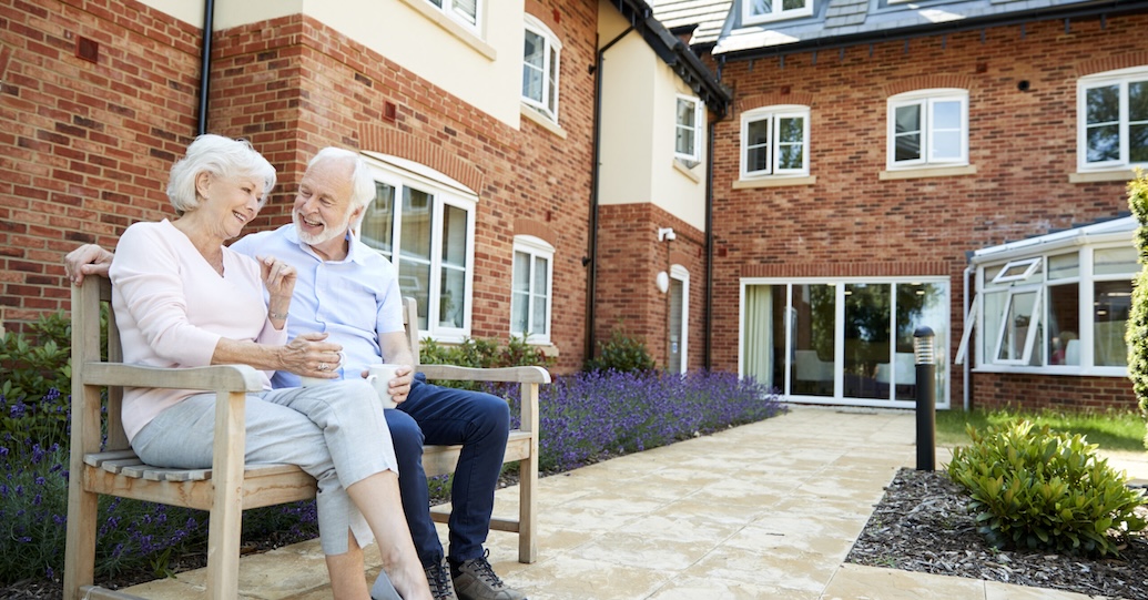 Seniors outside a housing apartment